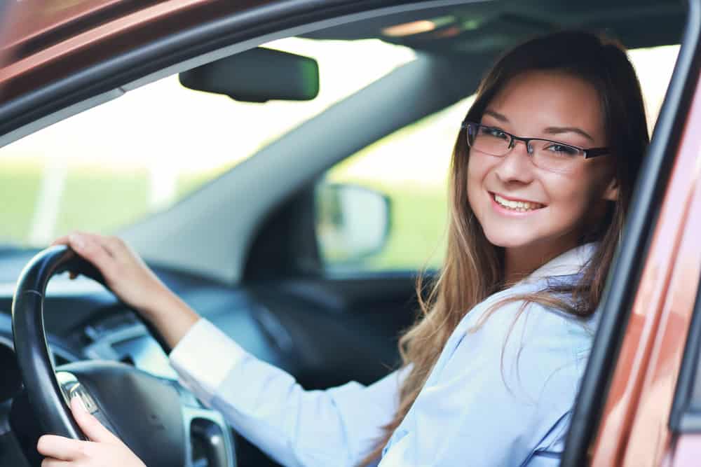 Confident young woman taking a driving test