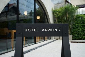 Hotel parking sign outside a modern hotel, illustrating how unused parking spaces can be monetised.