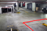 Parking lot next to lifts and ramp, easy access with fold down parking bollard