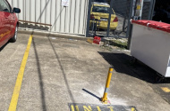 Bollard reserved parking space in Phillip Business District