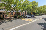 Lockup garage small commercial building carspace. North & Southbound Pacific Hwy bus stops at door.