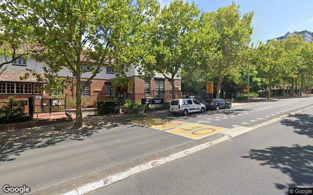 Lockup garage small commercial building carspace. North & Southbound Pacific Hwy bus stops at door.