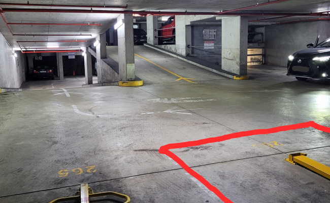 Parking lot next to lifts and ramp, easy access with fold down parking bollard