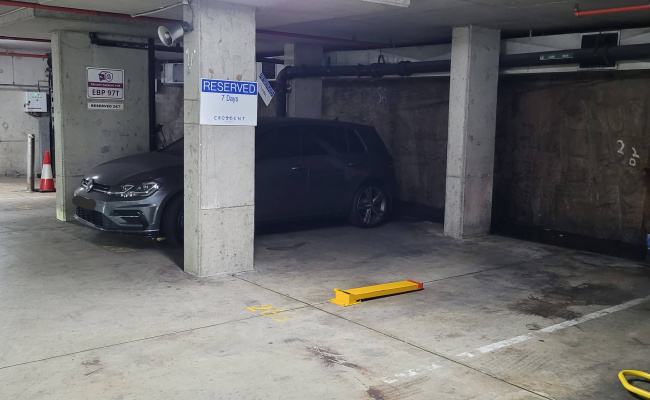 Parking lot next to lifts and ramp, easy access with fold down parking bollard