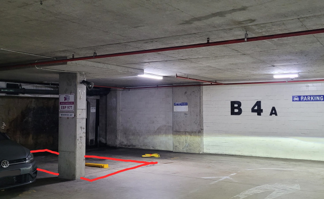 Parking lot next to lifts and ramp, easy access with fold down parking bollard