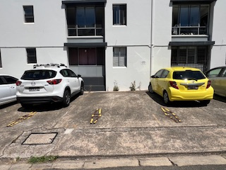 Open-air parking bay near Moore Park