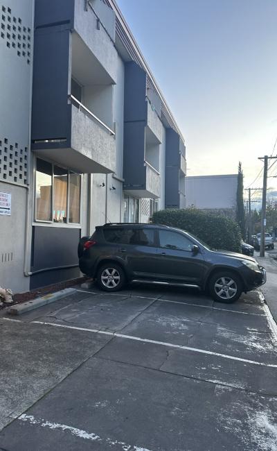 Private outdoor parking space in a residential apartment complex in South Yarra.
