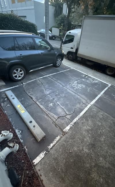 Private outdoor parking space in a residential apartment complex in South Yarra.