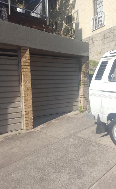 Lockup garage and driveway parking spot