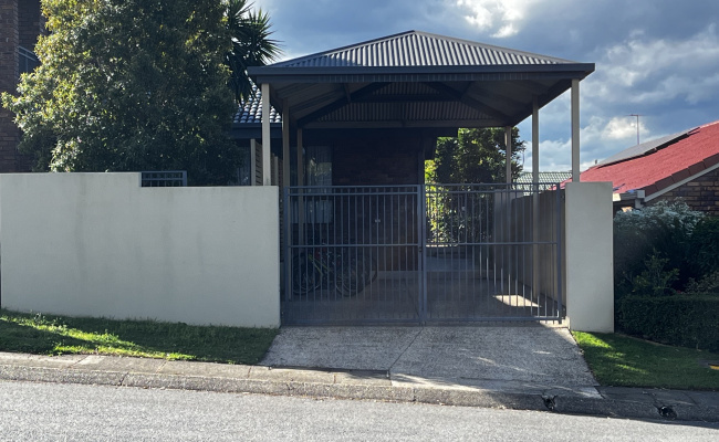 Secure Covered Parking Space Behind Locked Gate Easy Access