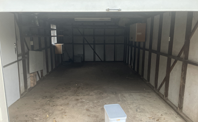 Large garage for storage/vehicle or even to hide your car project from the wife