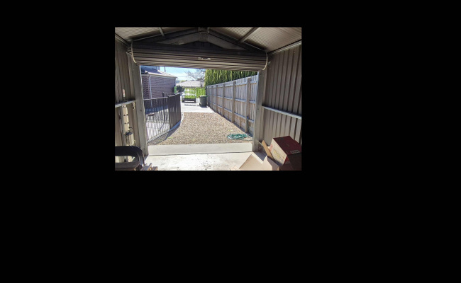 open parking for 1 or 2 vehicles inside house's fence