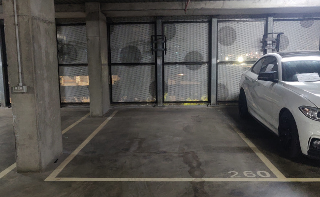 This indoor lot parking space is located inside the residential building in Docklands.