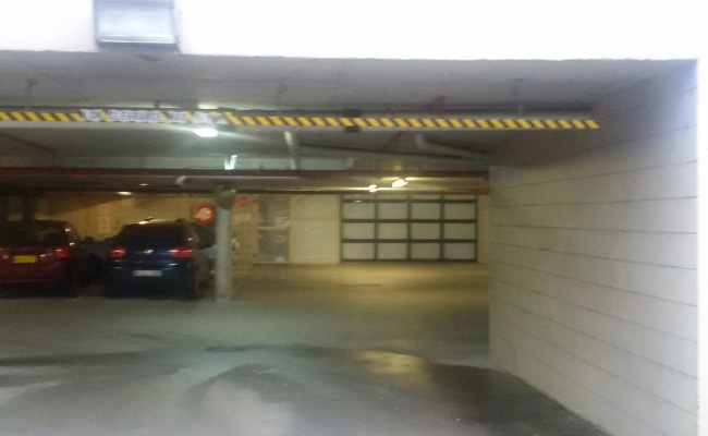 Secure, covered car parking space available