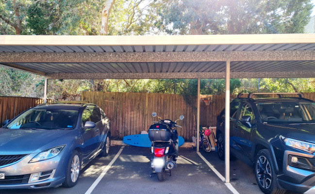 Parking space with roof