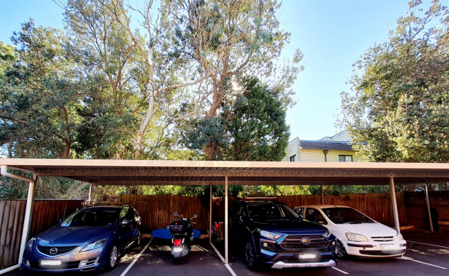 Parking space with roof