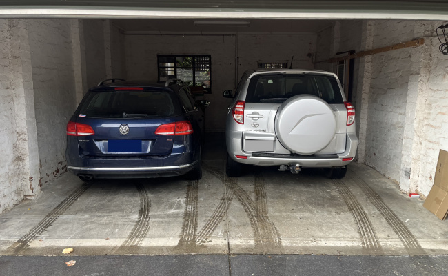 You're booking LEFT SIDE - easy, secure garage near Smith & Gertrude St. Fits 2 cars.