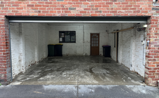 You're booking LEFT SIDE - easy, secure garage near Smith & Gertrude St. Fits 2 cars.