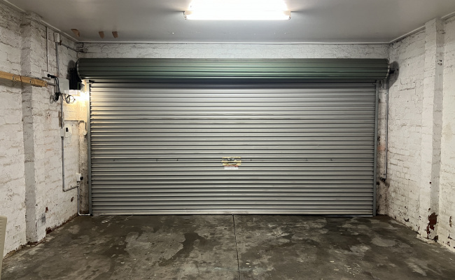 You're booking LEFT SIDE - easy, secure garage near Smith & Gertrude St. Fits 2 cars.