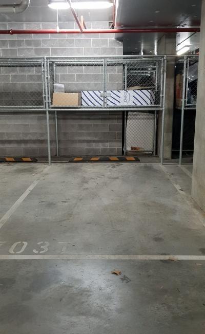 Secure indoor parking spot with storage